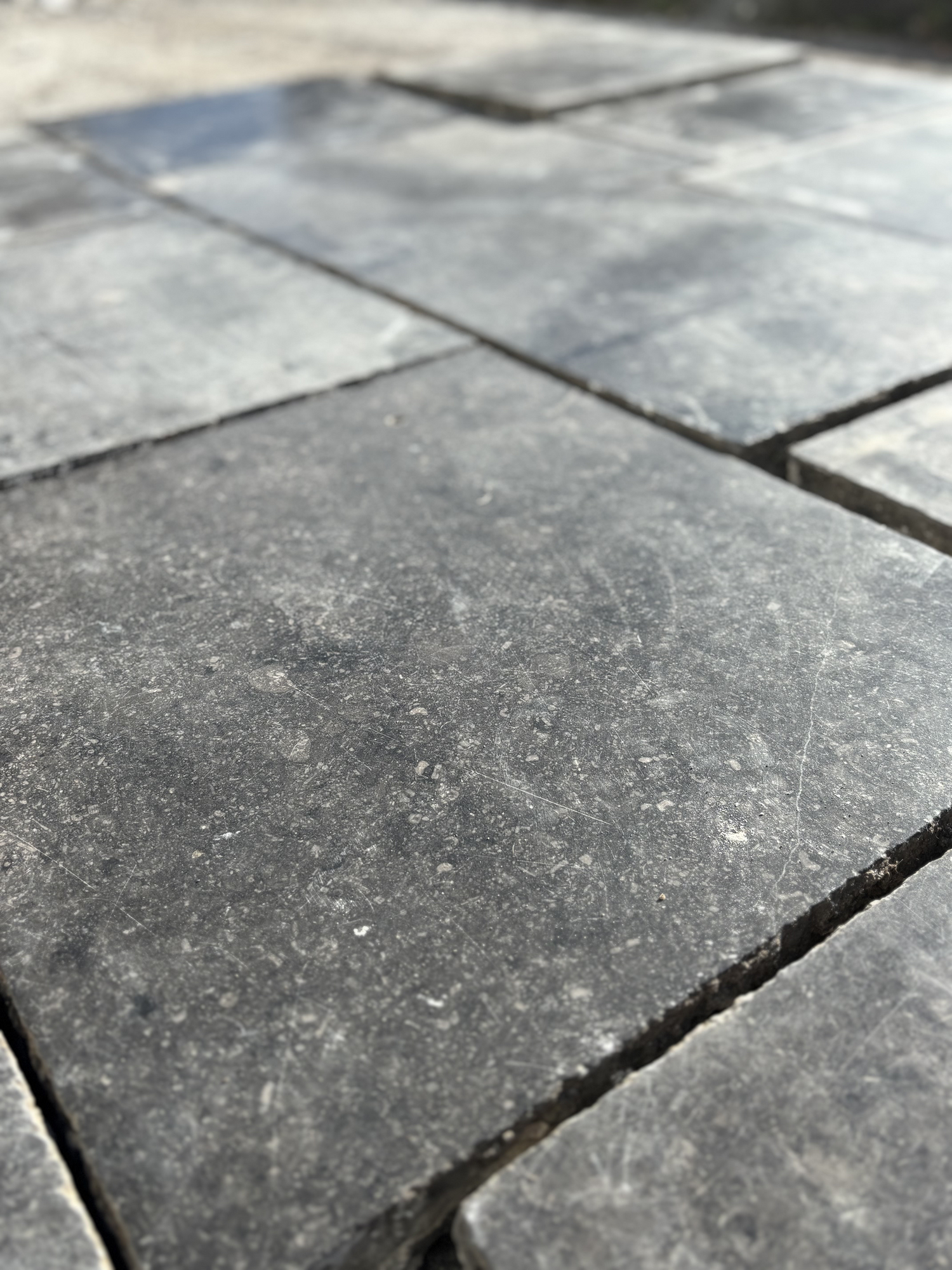 Close-up of gray stone tiles on a patio