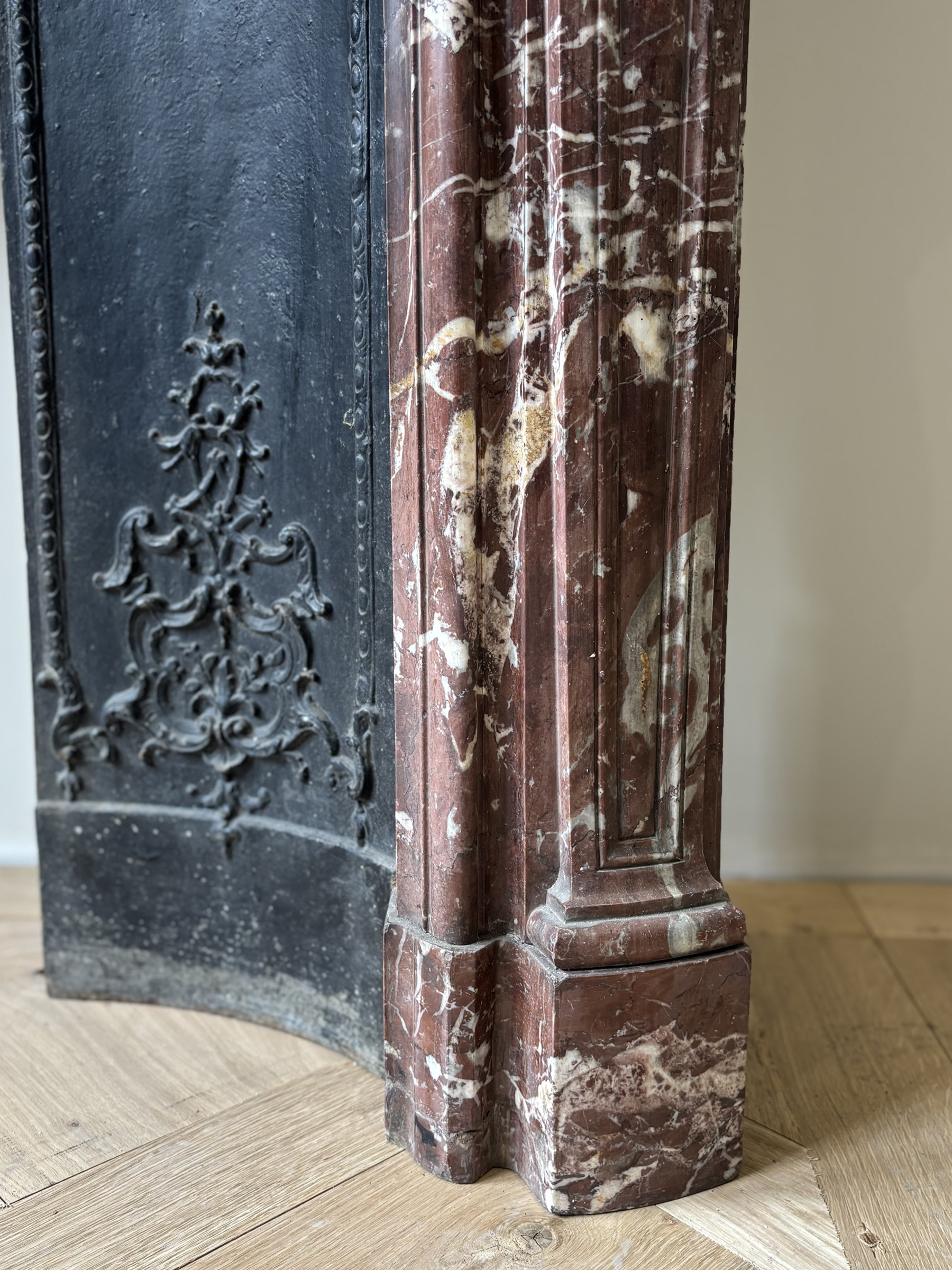 Fireplace In Red Marble Veined With White, With Wrought Iron Plate