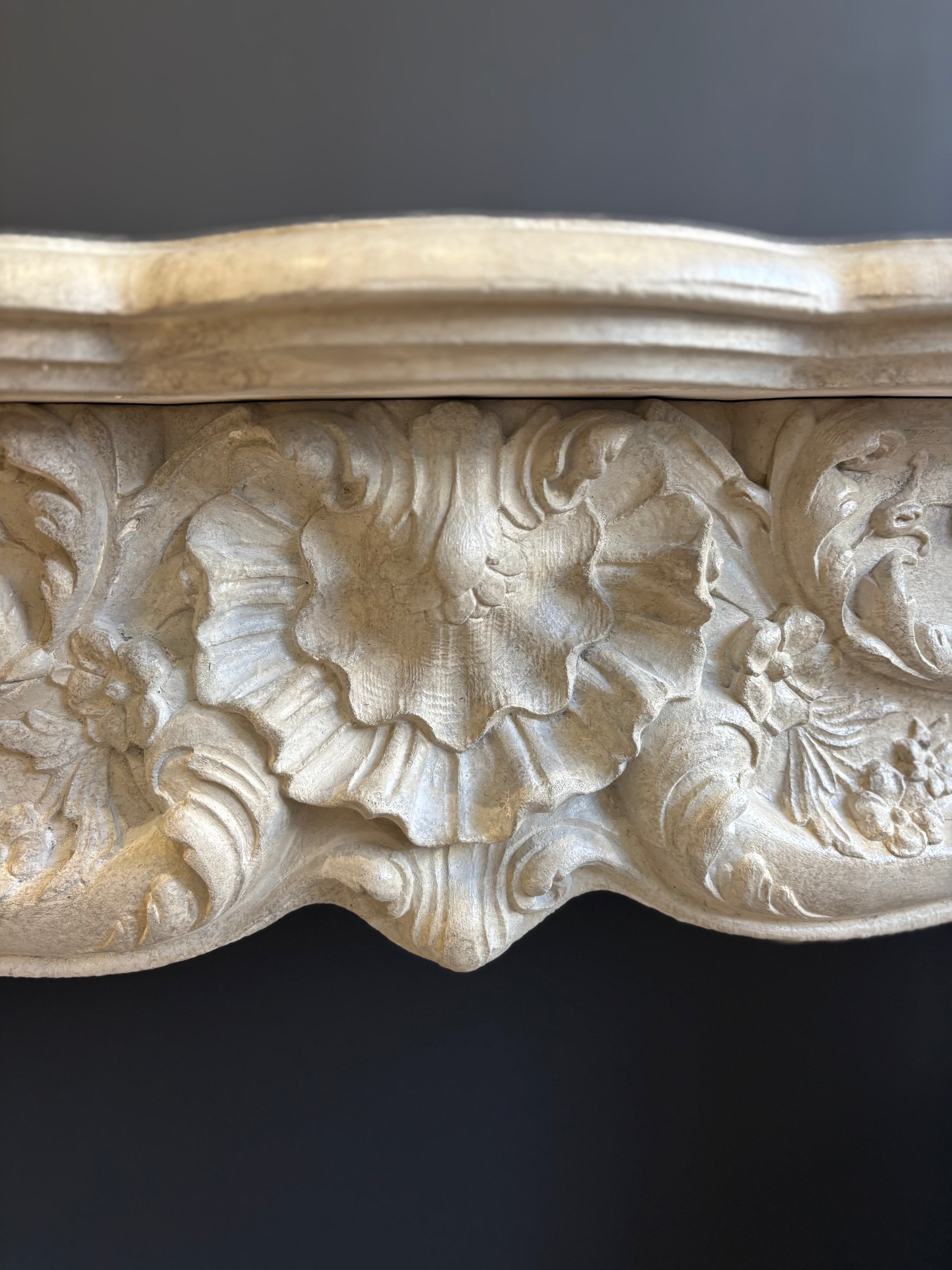 Classic Sculpted Stone Fireplace – Elegance and Refined Craftsmanship