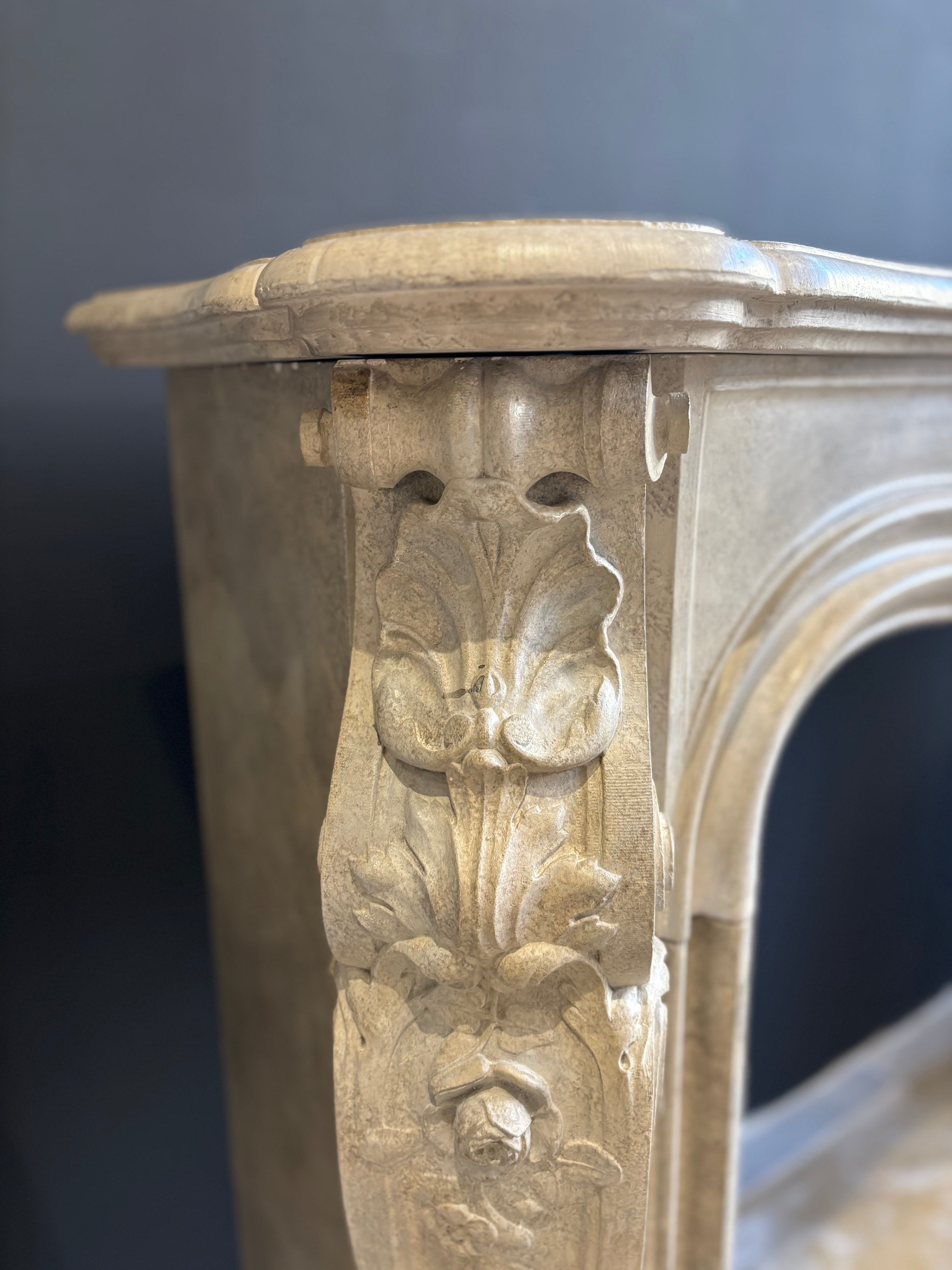 Classic Sculpted Stone Fireplace – Elegance and Refined Craftsmanship