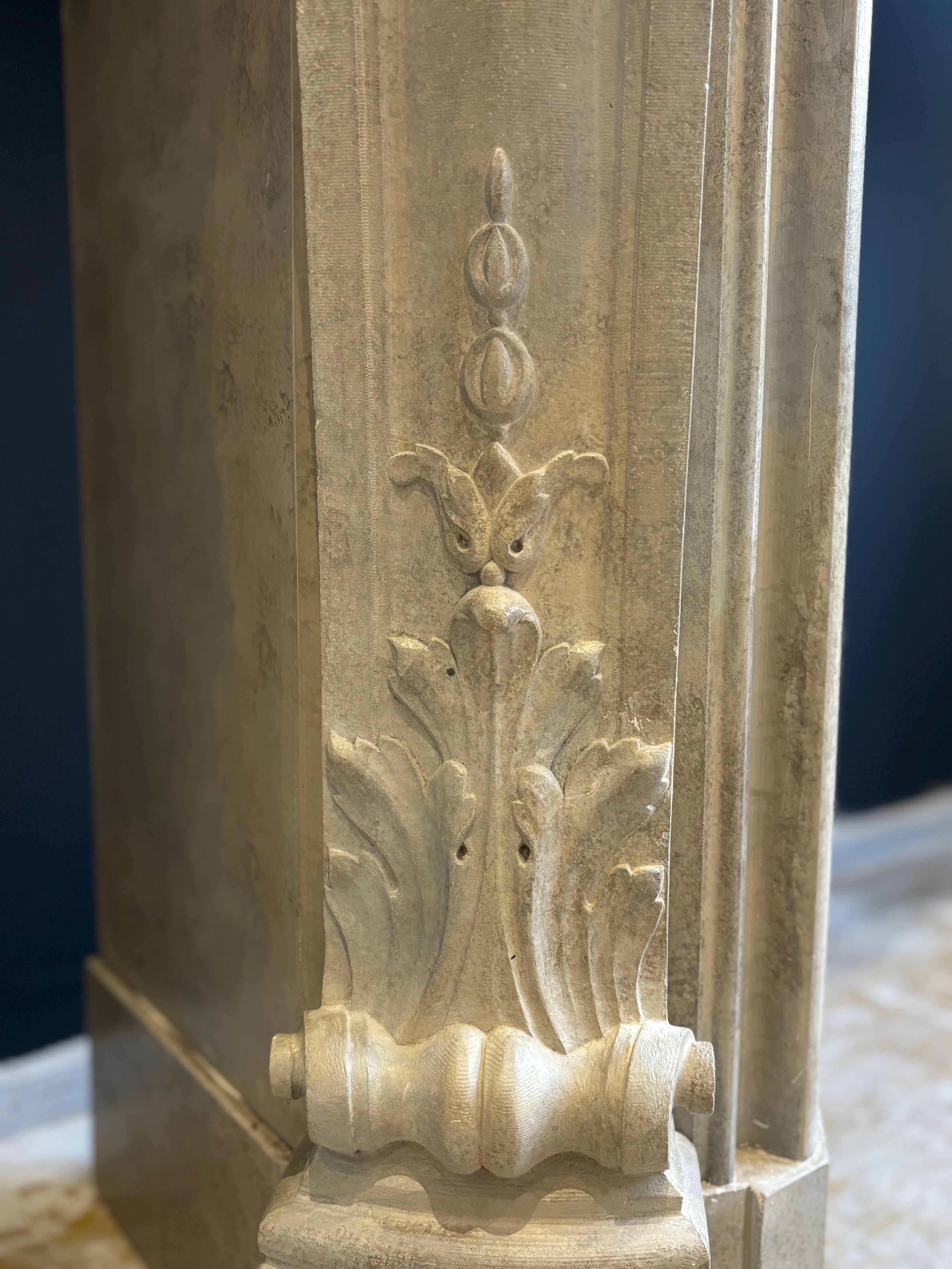 Classic Sculpted Stone Fireplace – Elegance and Refined Craftsmanship