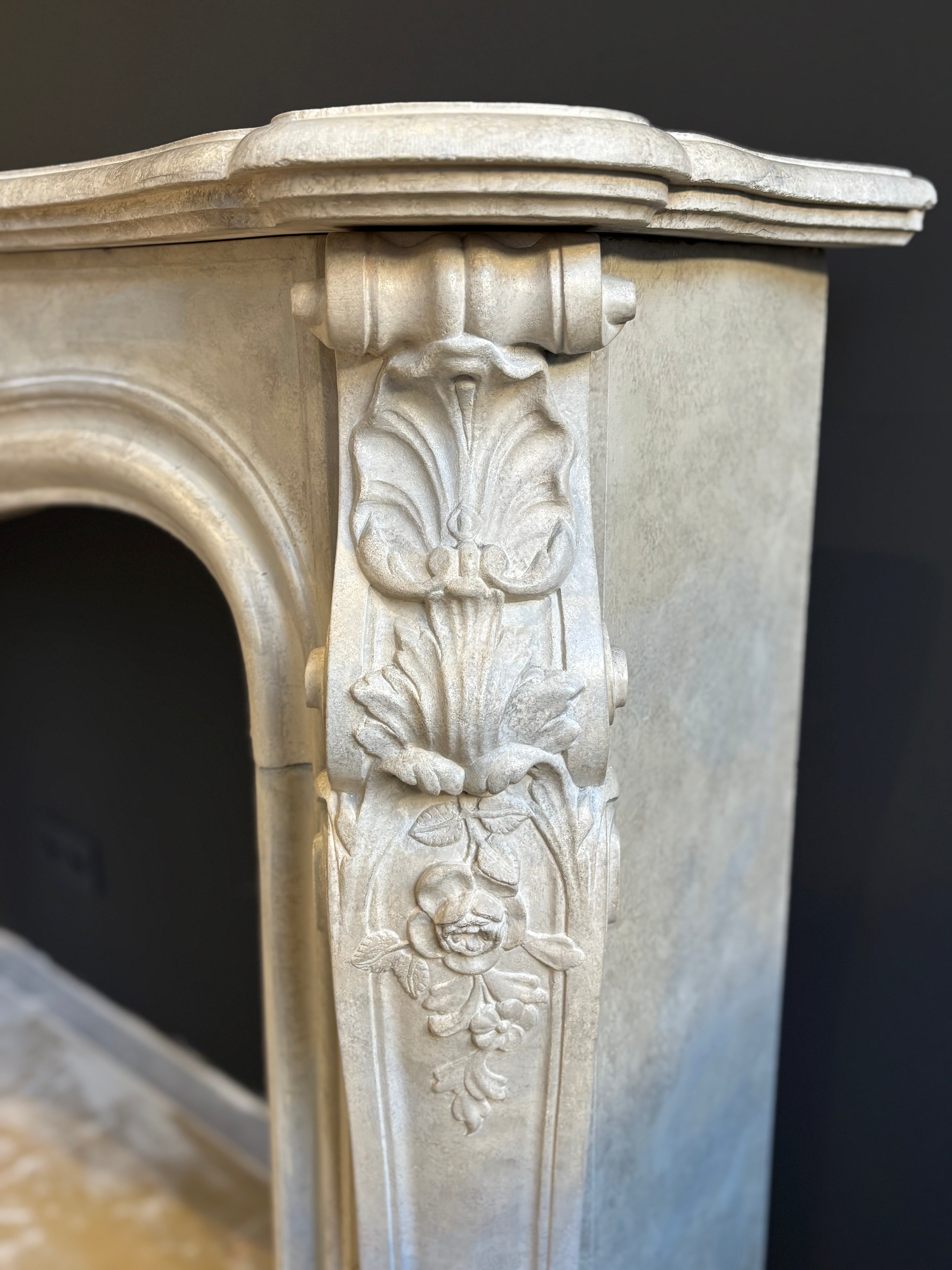 Classic Sculpted Stone Fireplace – Elegance and Refined Craftsmanship