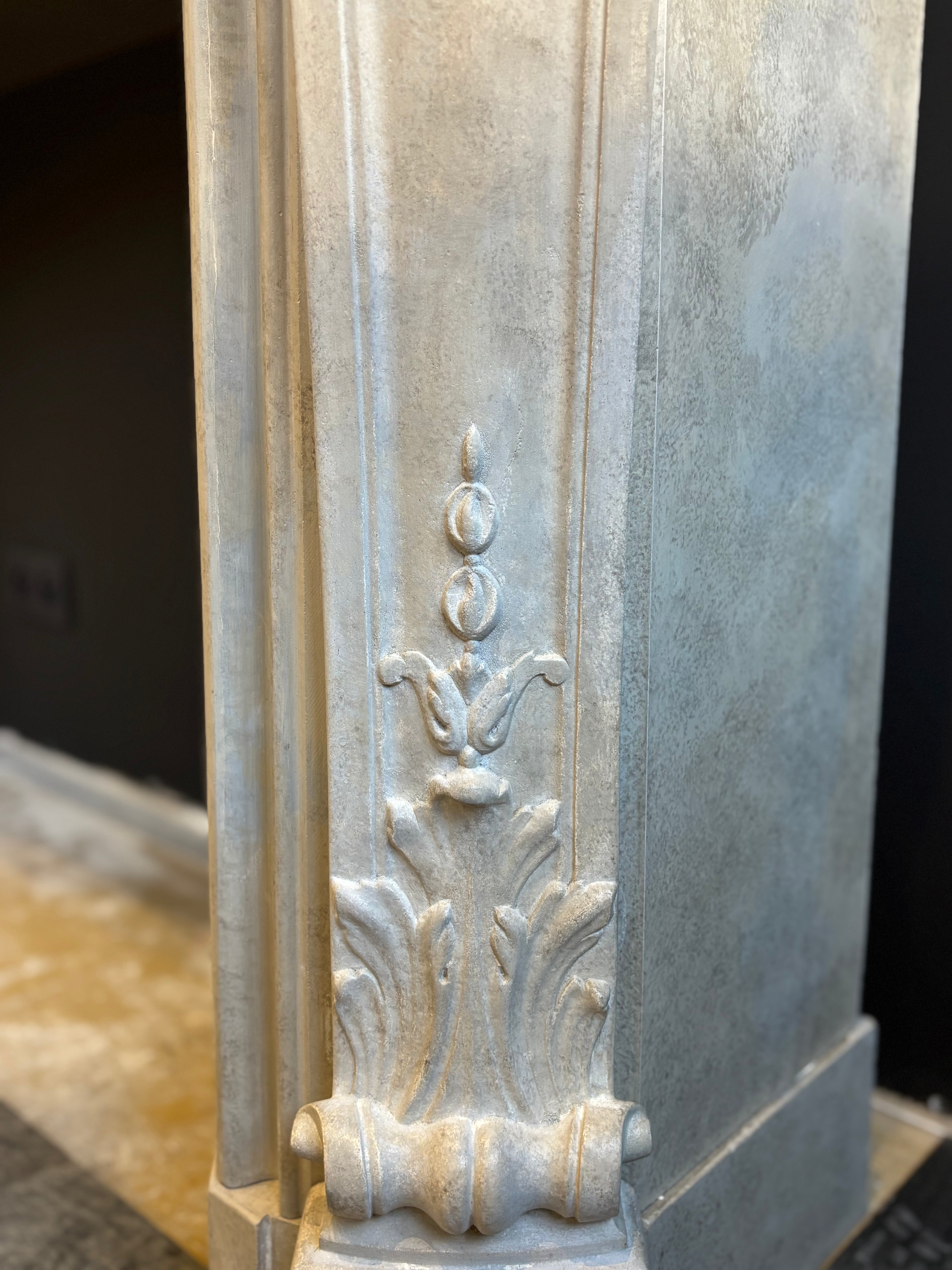 Classic Sculpted Stone Fireplace – Elegance and Refined Craftsmanship