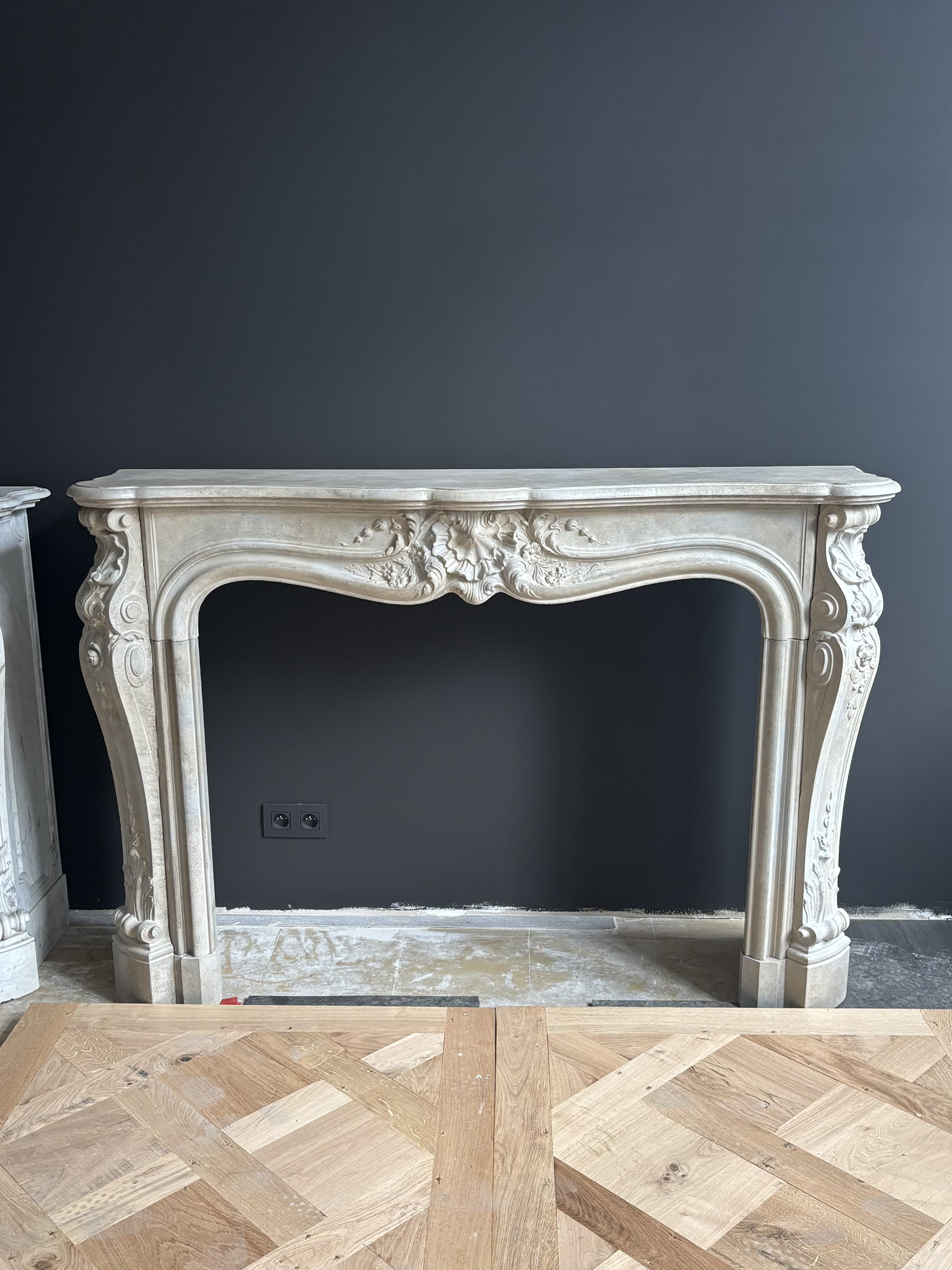 Classic Sculpted Stone Fireplace – Elegance and Refined Craftsmanship