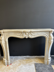 Classic Sculpted Stone Fireplace – Elegance and Refined Craftsmanship